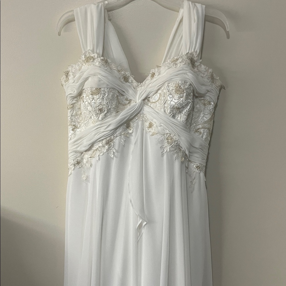 ENCHANTING by Cheri Ivory wedding Gown with gold Floral Embellishments.